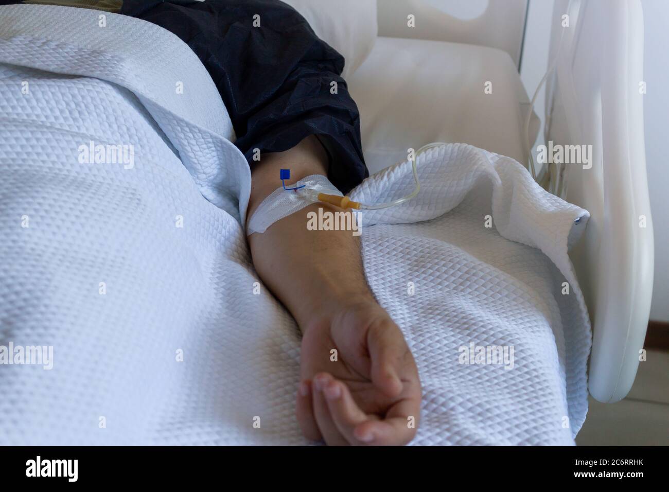Male patient with a serum in the hospital Stock Photo