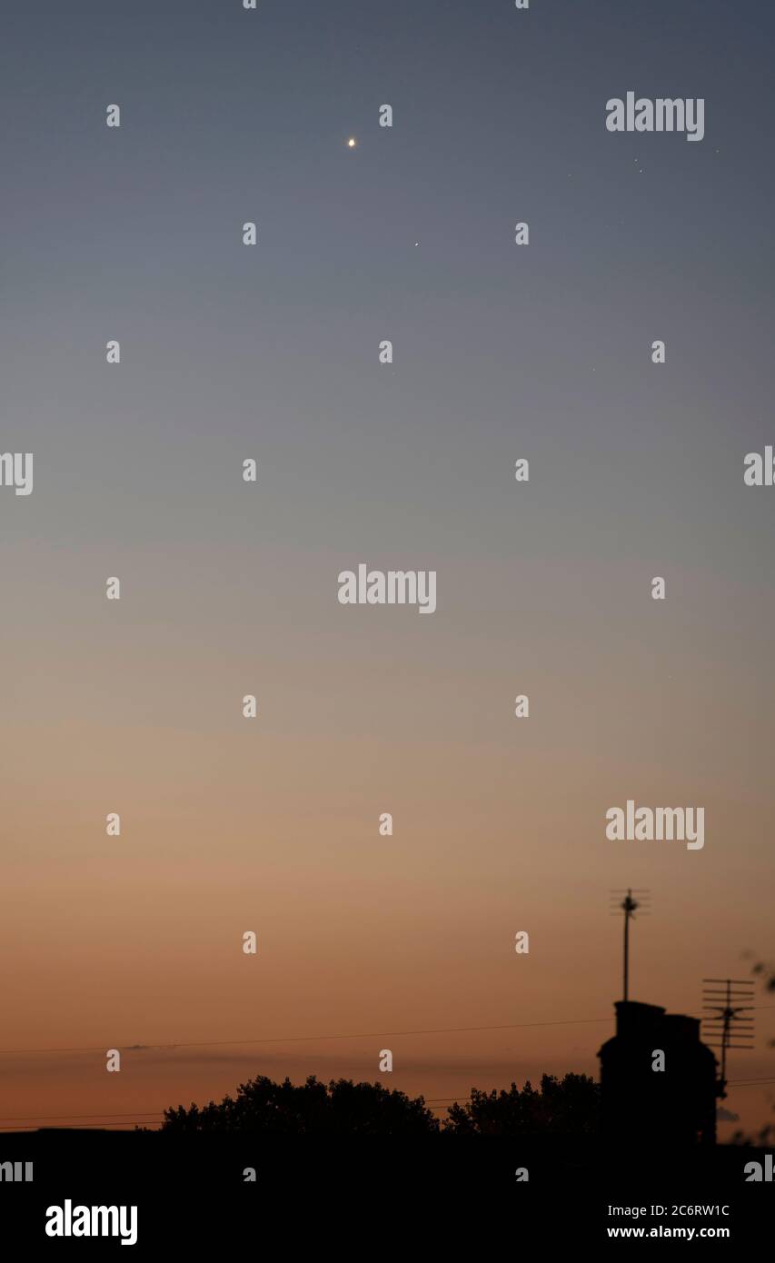 Wimbledon, London, UK. 12 July 2020. As Comet Neowise fades towards dawn the planet Venus shines brightly above the star Aldebaran in the eastern skyover suburban rooftops before dawn. Credit: Malcolm Park/Alamy Live News. Stock Photo