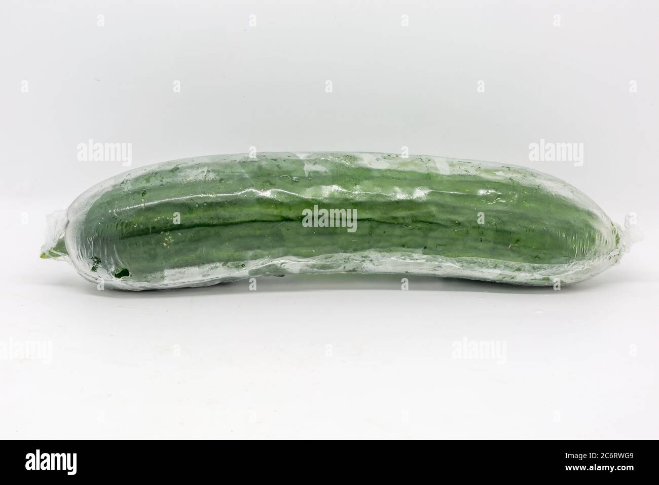 A whole cucumber wrapped in plastic Stock Photo Alamy