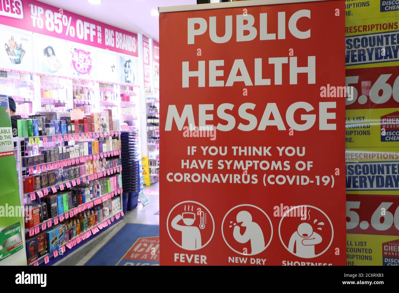 Covid19 (coronavirus) public health message at the entrance to Chemist Warehouse discount