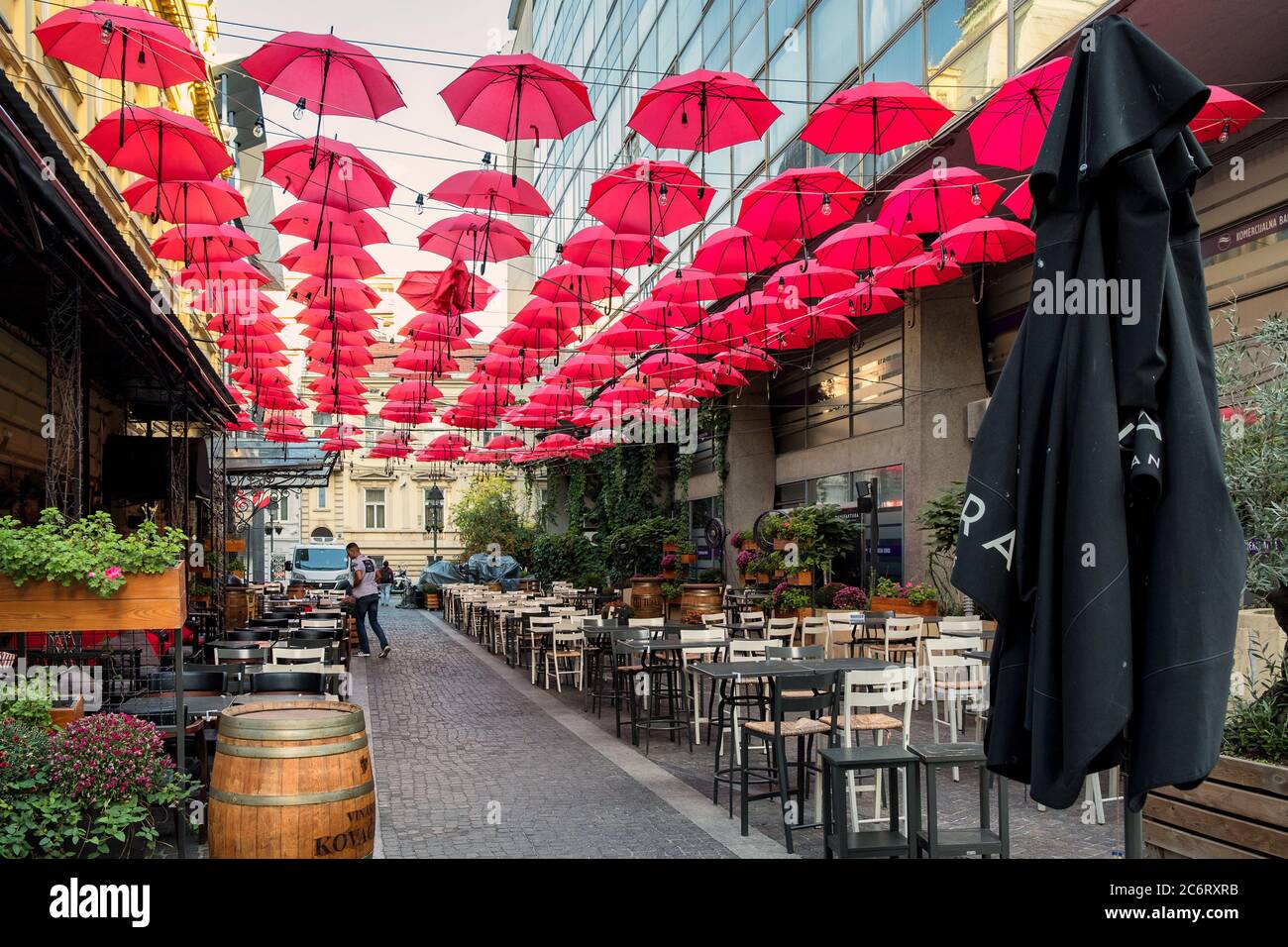 Belgrade / Serbia - October 6, 2018: Red umbrellas above the open-air restaurant in King Peter street, in old bohemian part of Serbian capital Belgrad Stock Photo