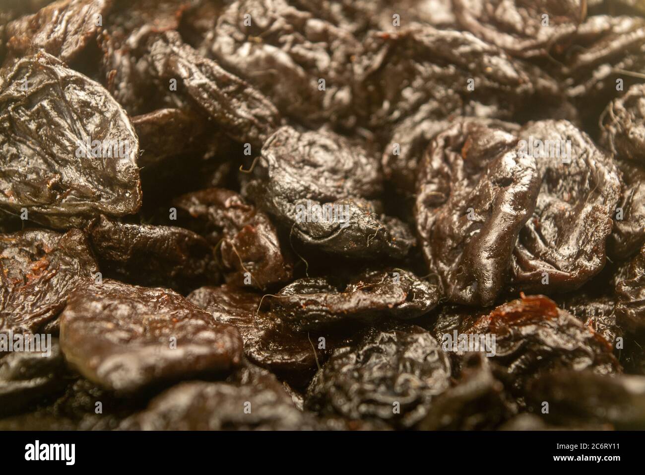 Dried prunes in bulk. Surface texture. Close up Stock Photo Alamy