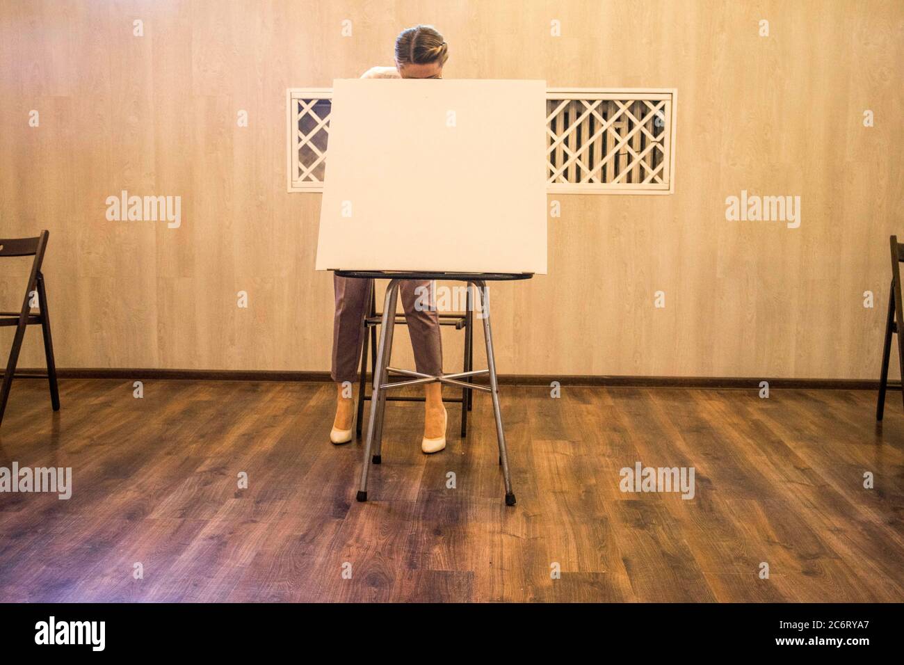 Poznan, Wielkopolska, Poland. 12th July, 2020. The second - decisive - round of the presidential election in Poland began at 7 am and will last until 9 pm. In the picture: disinfection of the voting table at the polling station. Credit: Dawid Tatarkiewicz/ZUMA Wire/Alamy Live News Stock Photo