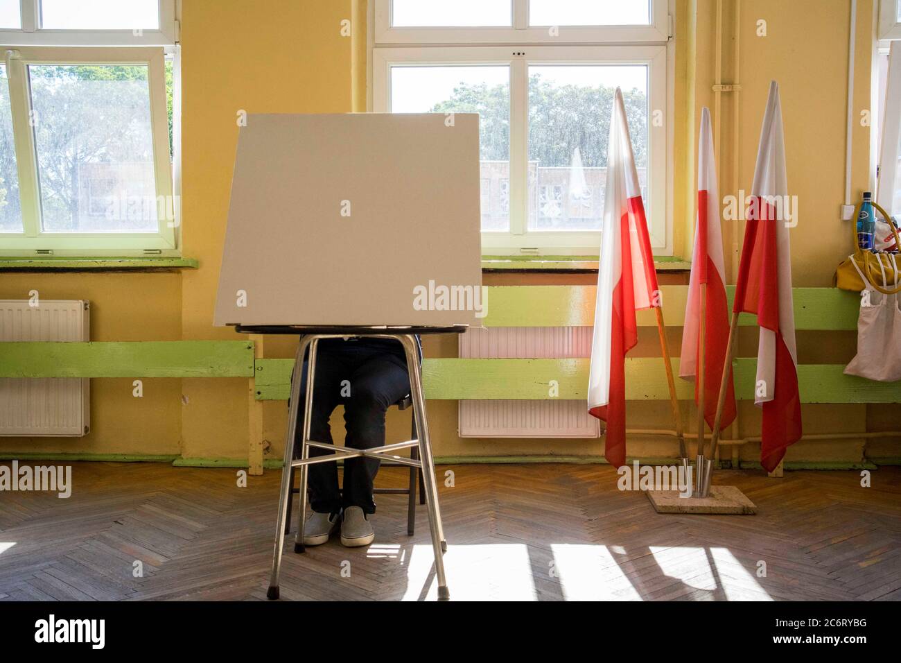 Poznan, Wielkopolska, Poland. 12th July, 2020. The second - decisive - round of the presidential election in Poland began at 7 am and will last until 9 pm. In the picture: the voting person in the polling station. The publication in the negative context is forbidden. Credit: Dawid Tatarkiewicz/ZUMA Wire/Alamy Live News Stock Photo