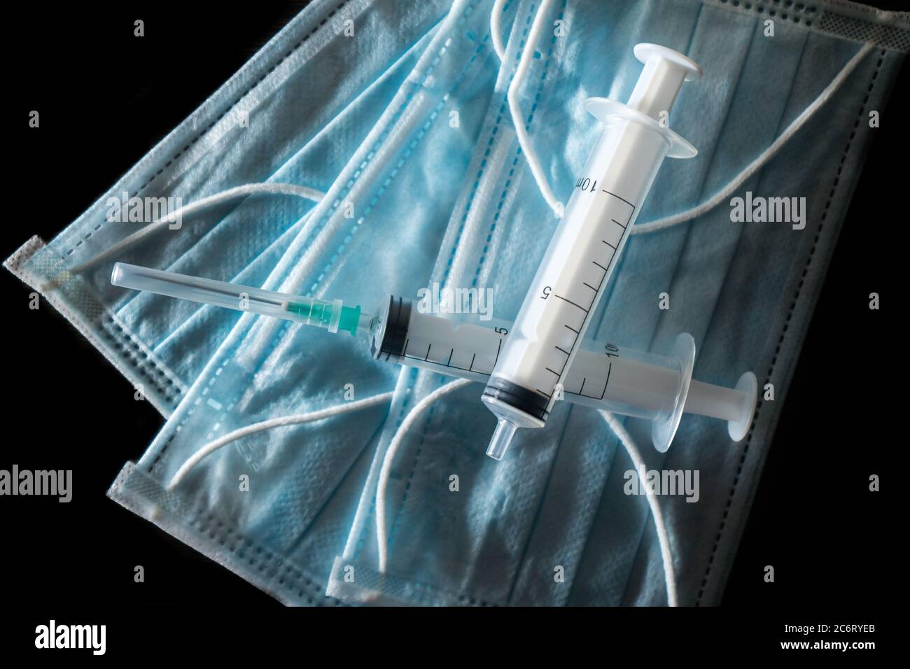 Medical mask and syringes. Coronovirus covid-19 2019-ncov epidemic  Stock Photo