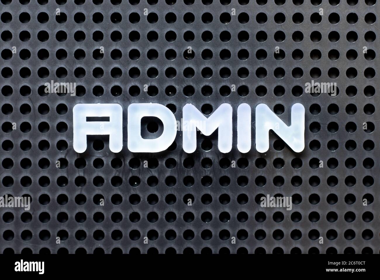 White color alphabet with word admin (Abbreviation of administration) on black pegboard background Stock Photo