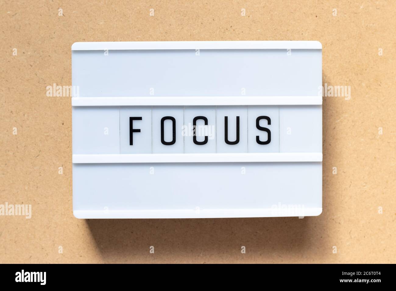White lightbox with word focus on wood background Stock Photo