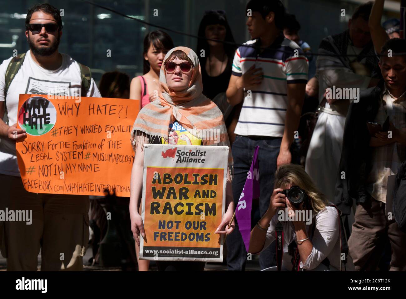 Protesters hold signs as they listen to speakers at the Sydney rally against ‘Islamophobia’. Stock Photo