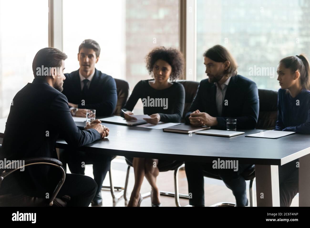 Young mixed race hr managers interviewing job candidate. Stock Photo