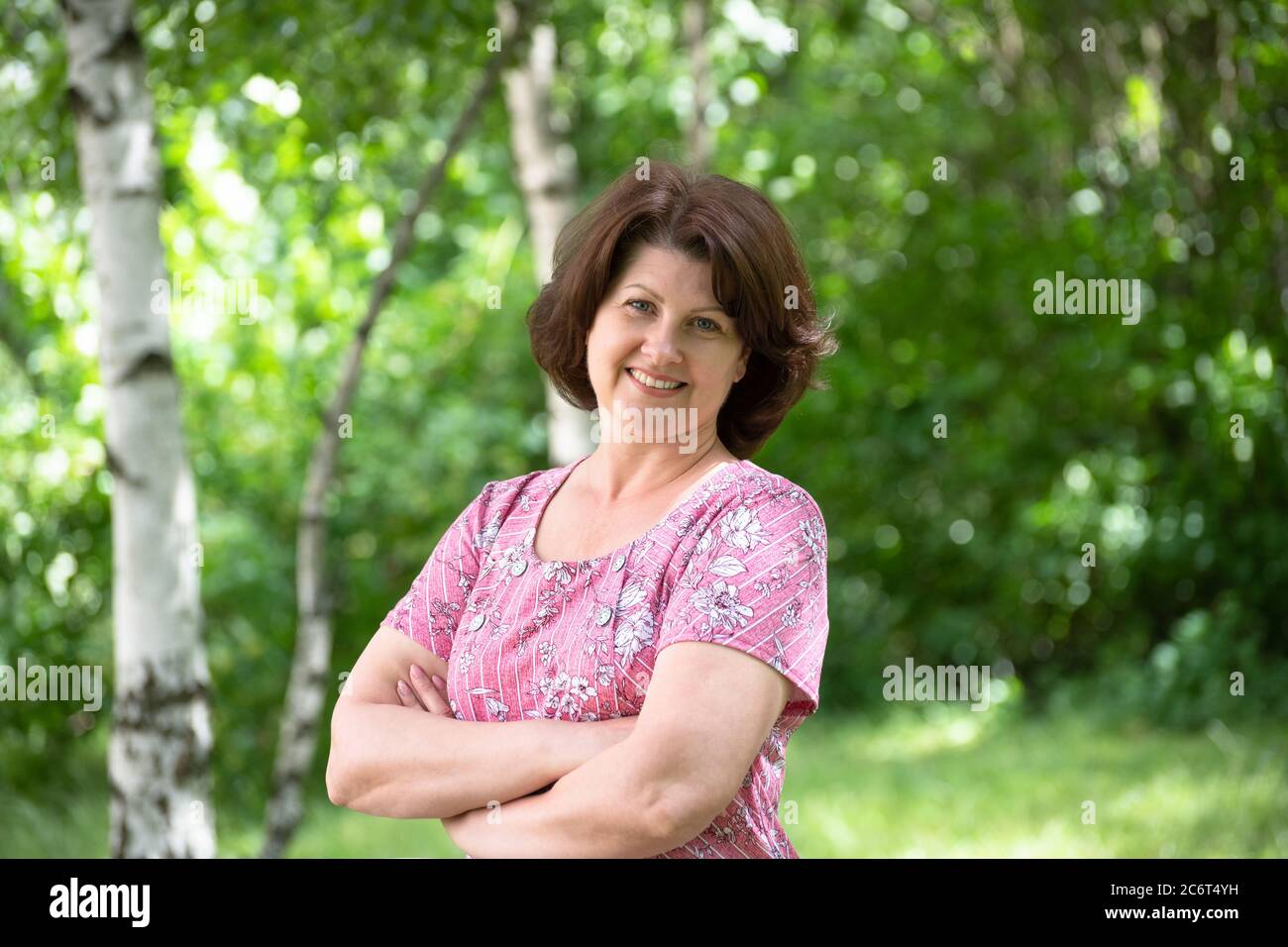 Woman in a pink dress hi-res stock photography and images - Alamy