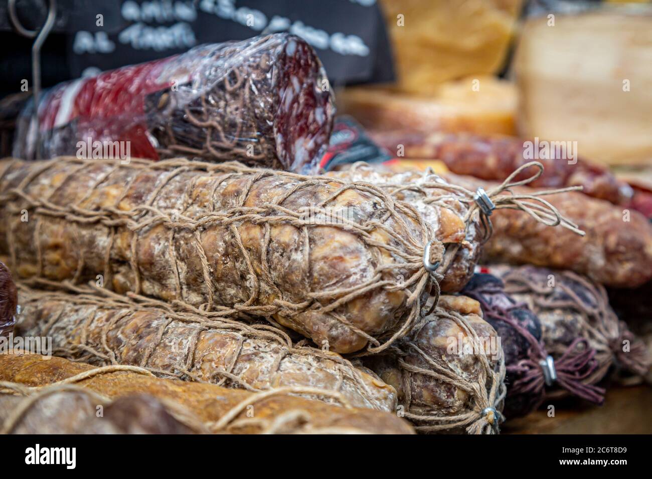 Cured meats for sale on a market stall Stock Photo Alamy
