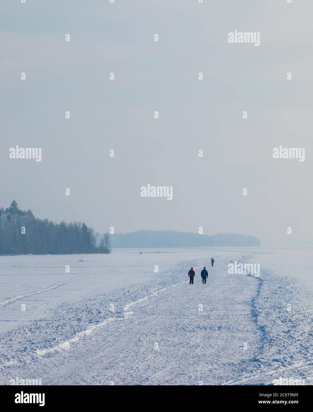 People walking on an ice road , plowed to the lake ice at Winter , Finland Stock Photo