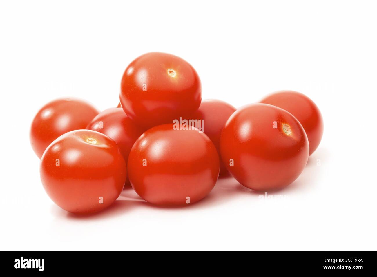 Group of ripe tomatoes isolated against white background Stock Photo ...