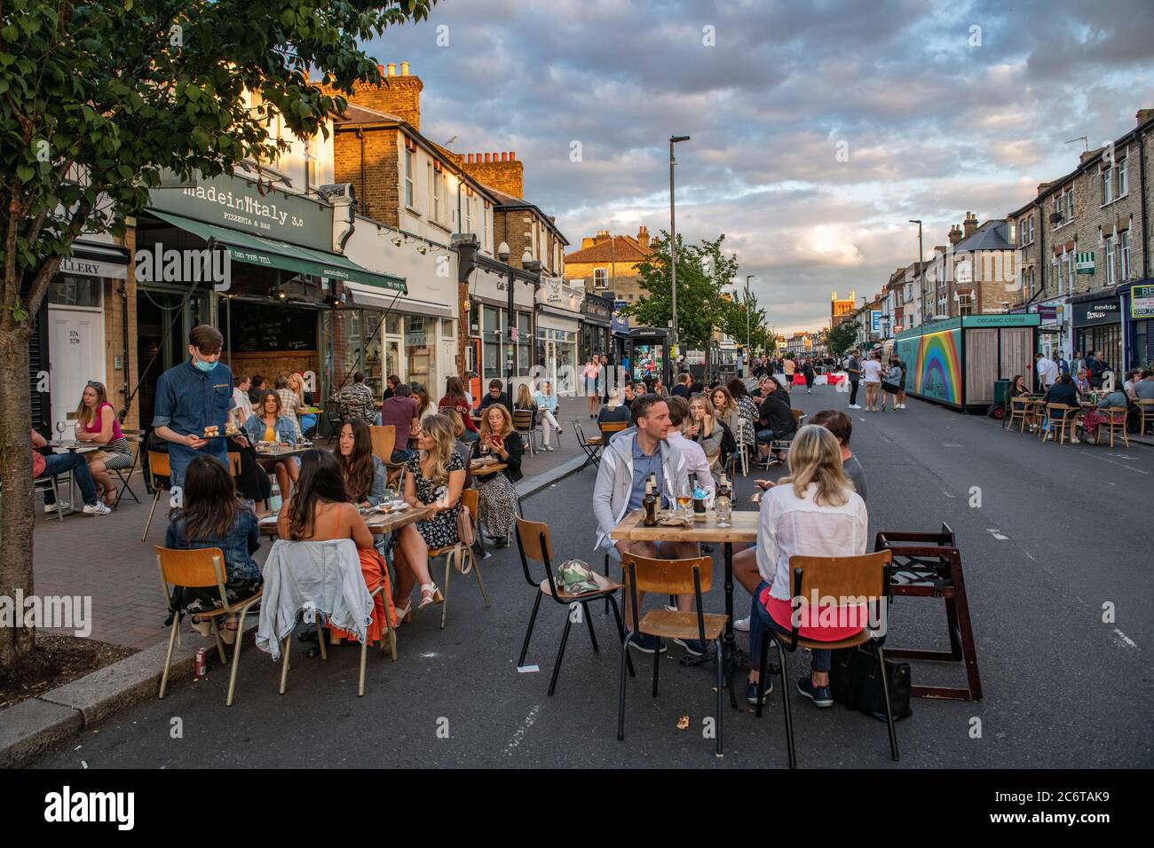 July 2020, with lockdown laws relaxed, Northcote Road in Clapham is pedestrianised to allow restaurants and bars to put tables in the road for diners Stock Photo