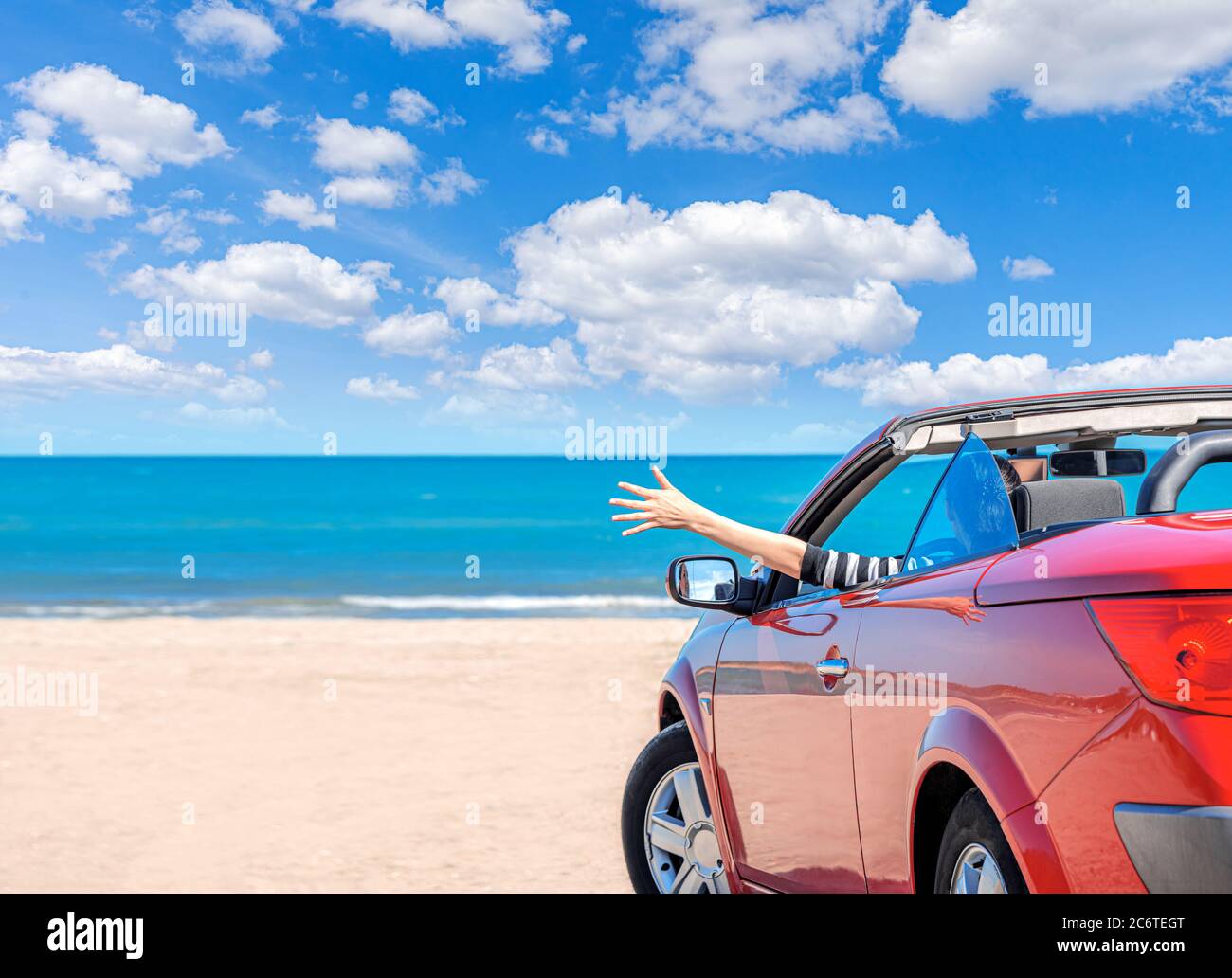 Red car on the beach Stock Photo - Alamy