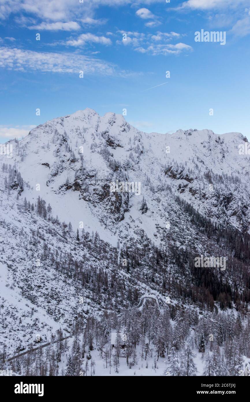 Vršič pass snow mountains road blue sky winter Slovenia Stock Photo