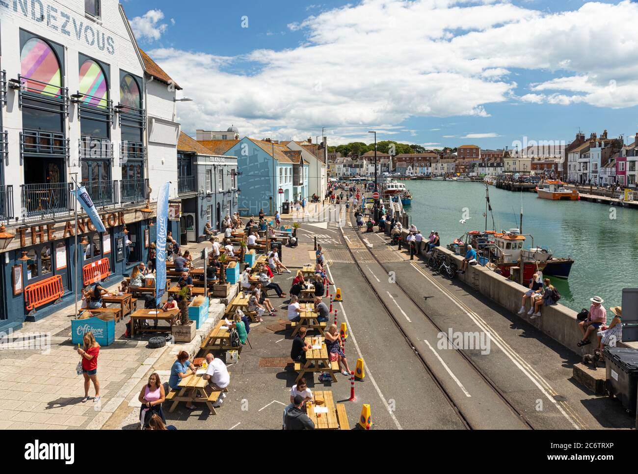 Social distancing measures in place at Custom House Quay, Weymouth Dorset, England, UK.  Covid 19 Stock Photo