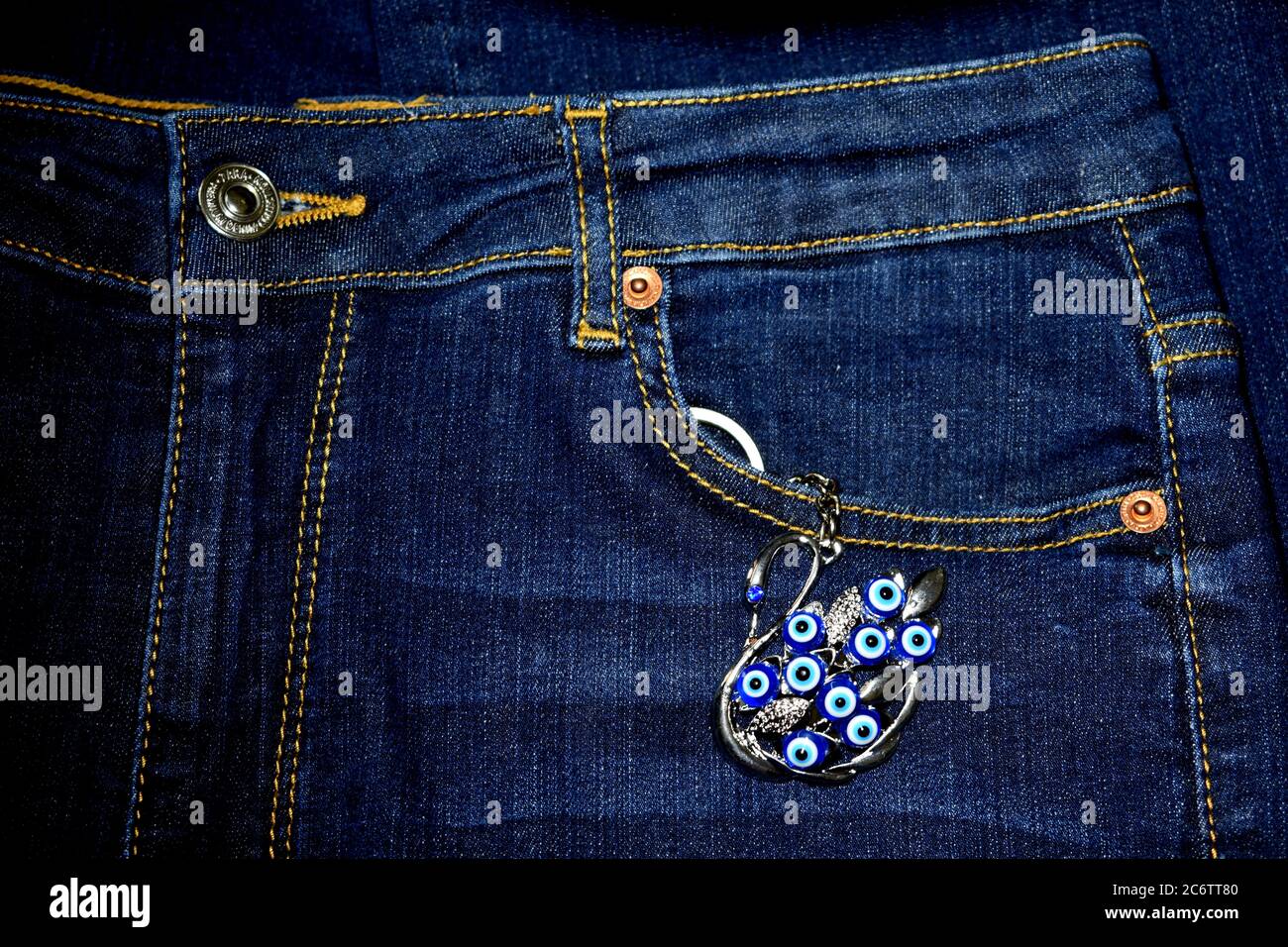 chain hanging from jeans