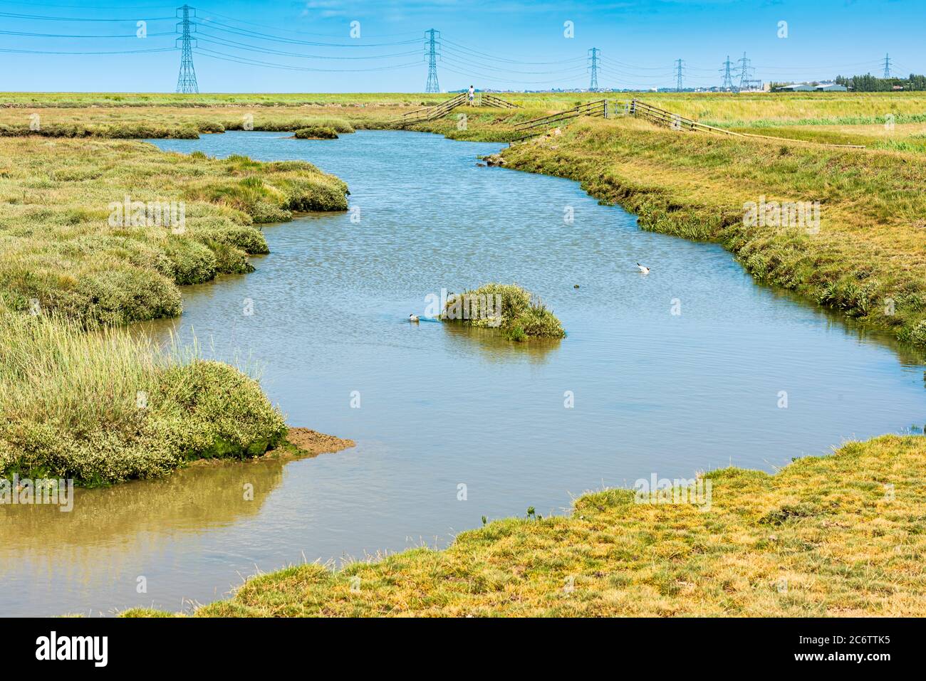 Faversham Creek and Electricity Pylons in Kent, England Stock Photo