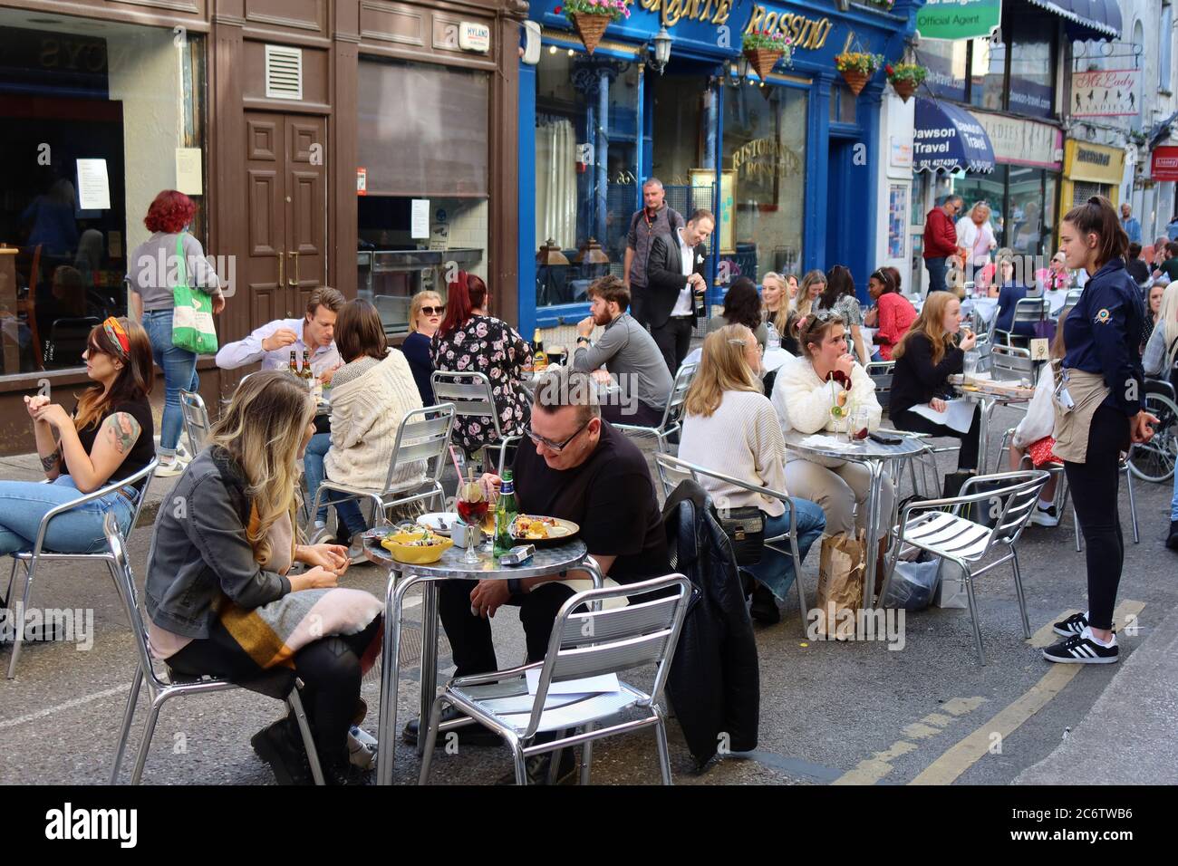 People enjoying dining out in restaurants on Princes street, Cork, Ireland Stock Photo