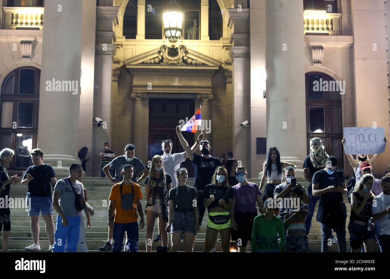 Belgrade, Serbia. 11th July, 2020. Police officers look on during the stand-off with protestors during the protest against the strict measures to fight the coronavirus in Belgrade, Serbia, 11 July 2020. Thousands have gathered in front of the Serbian Parliament in Belgrade to protest the new measures to stem the spread of the SARS-CoV-2 coronavirus, which causes the COVID-19 disease. Credit: Koca Sulejmanovic/Alamy Live News Stock Photo