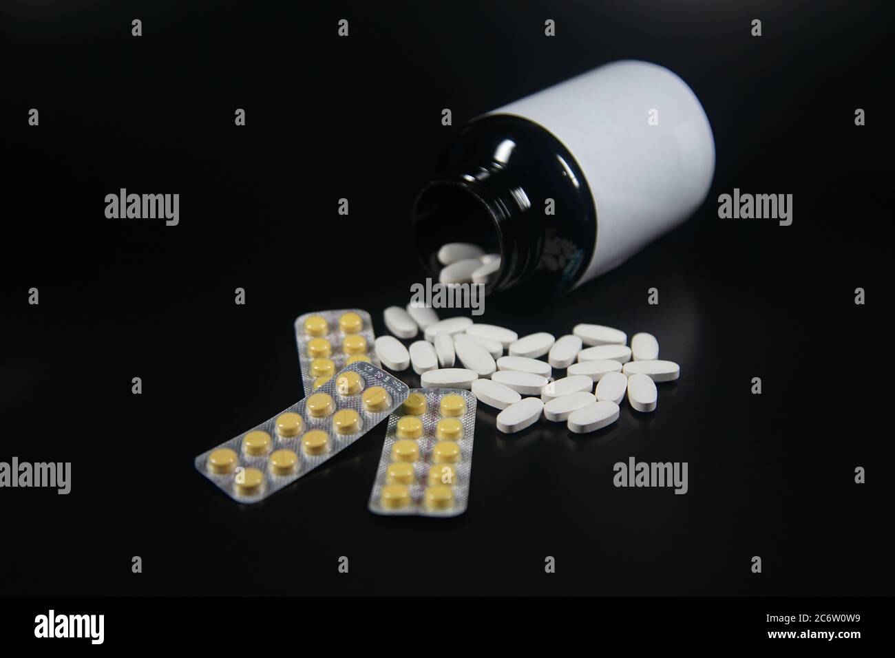 white medicine tablets with black bottle Stock Photo