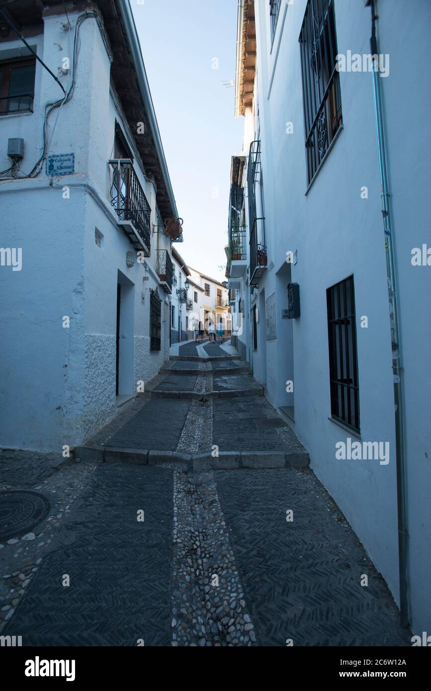 Narrow street in the Albaicin neighborhood Stock Photo