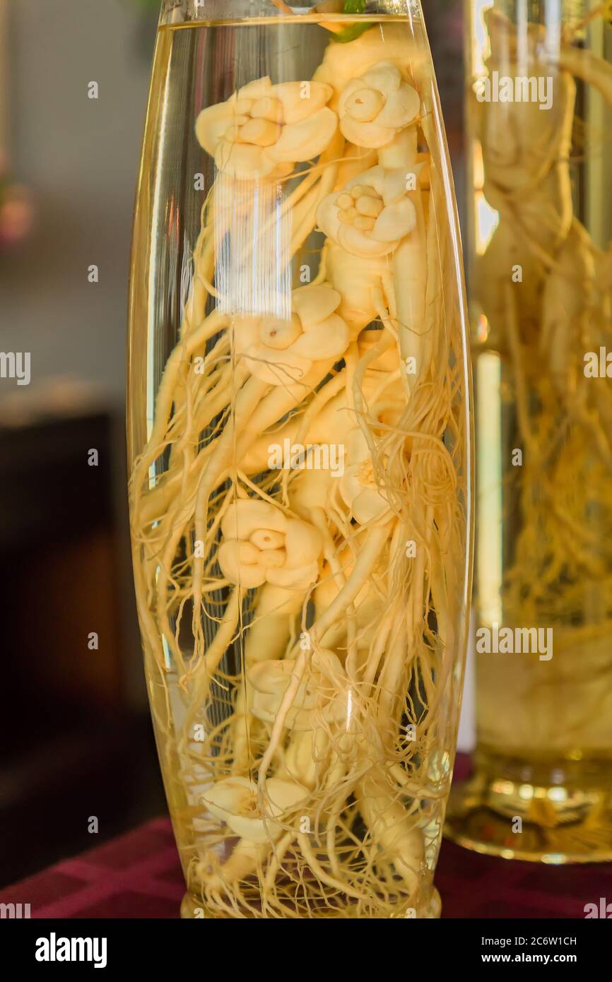ginseng in the glass bottle, close up Stock Photo Alamy