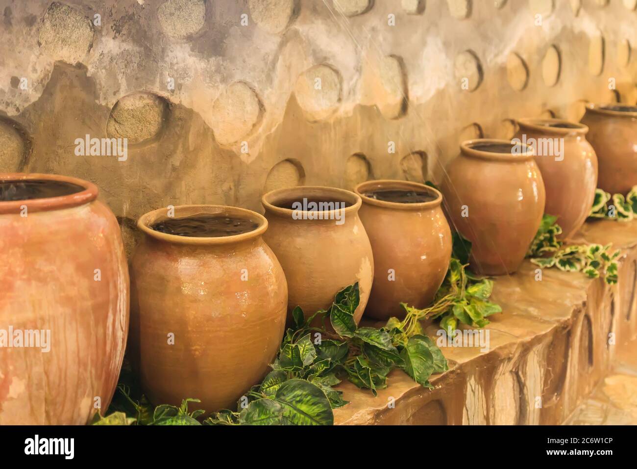 old clay pots standing in a row. Big jars with water Stock Photo Alamy