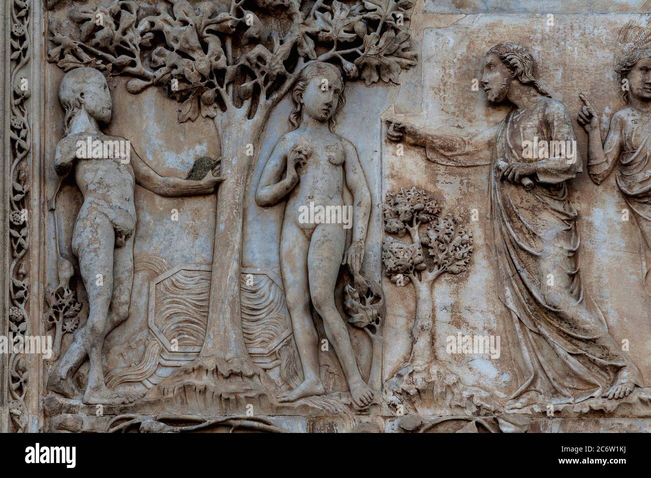 God forbids Adam and Eve to eat the fruit of the Tree of Knowledge of Good  and Evil in this close detail view of one of the Garden of Eden Old  Testament