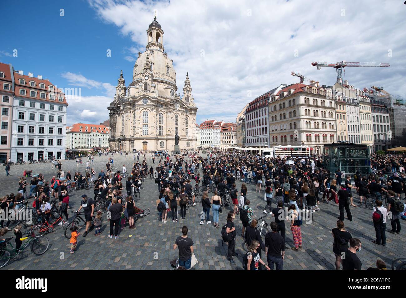 Dresden, Germany. 12th July, 2020. Participants in a demonstration against racism stand in front of the Frauenkirche on Neumarkt square. The rally of the 'Black Lives Matter Dresden' group wants to draw attention to structural racism after the violent death of George Floyd. Credit: Sebastian Kahnert/dpa-Zentralbild/dpa/Alamy Live News Stock Photo