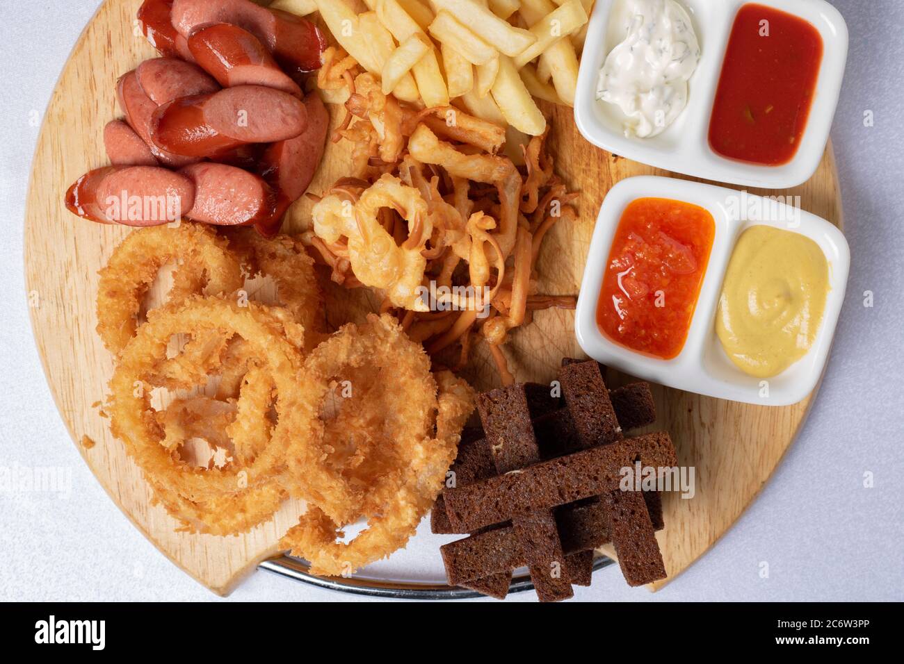 Beer snacks. Sauces, chips, potato, crispy bread . Top view Stock Photo