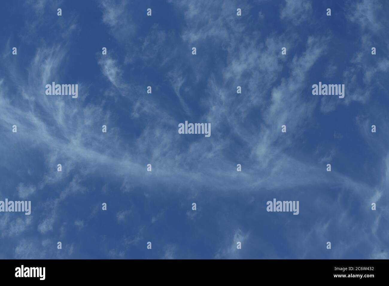 Cirrus clouds in a deep blue sky Stock Photo