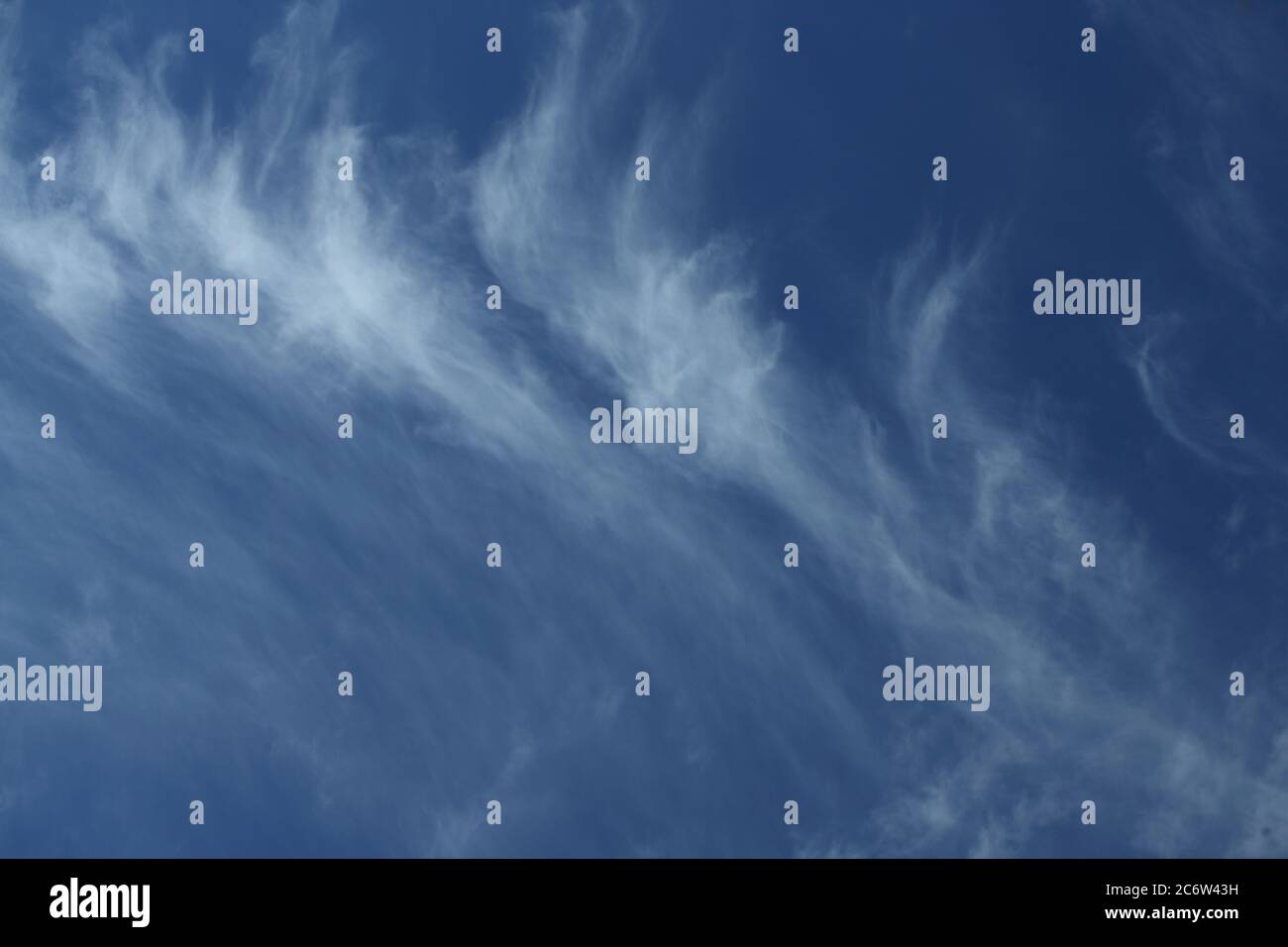 Cirrus clouds in a deep blue sky Stock Photo
