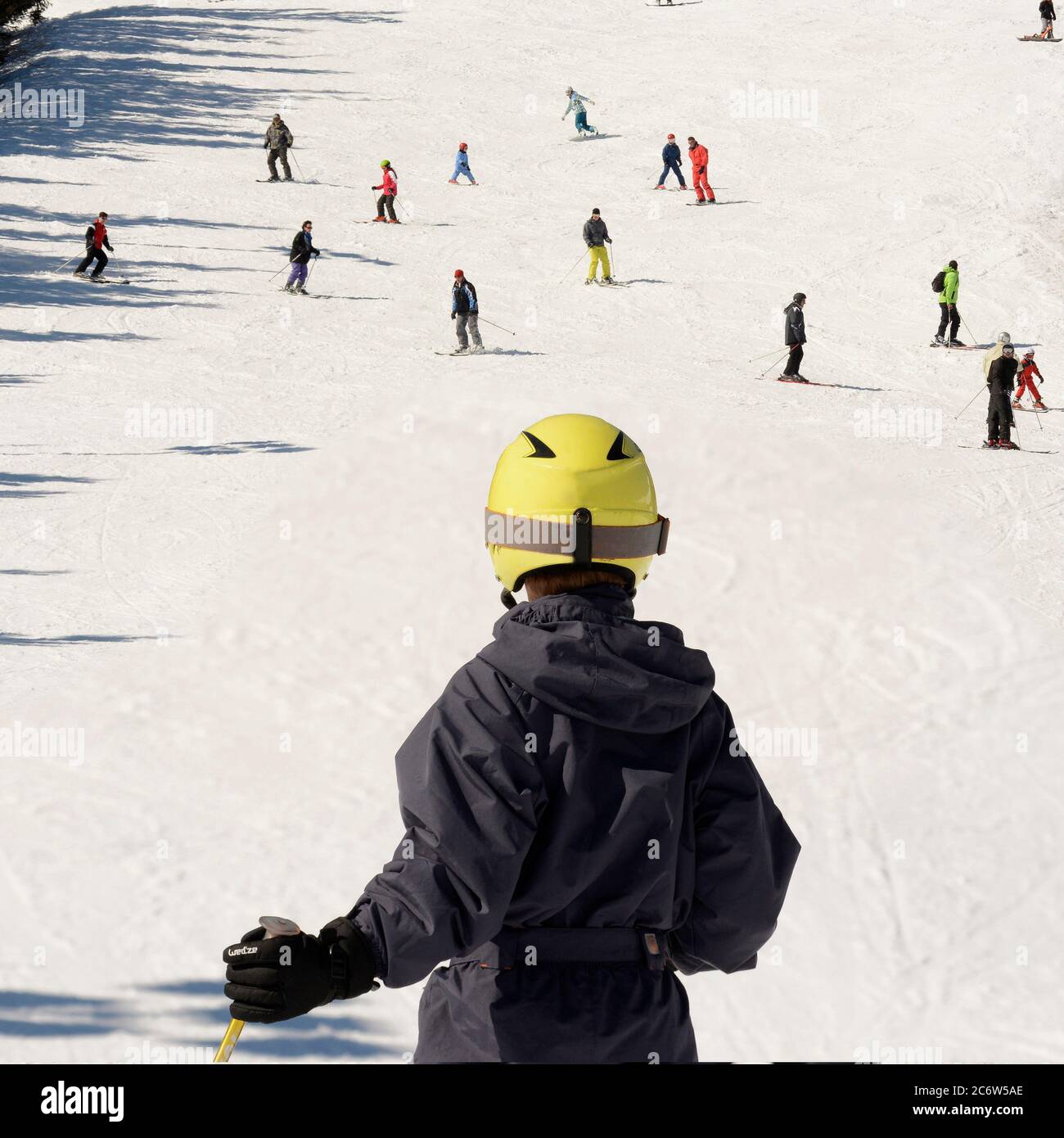 Young skier on ski slope, , Auvergne-Rhone-Alpes, France Stock Photo