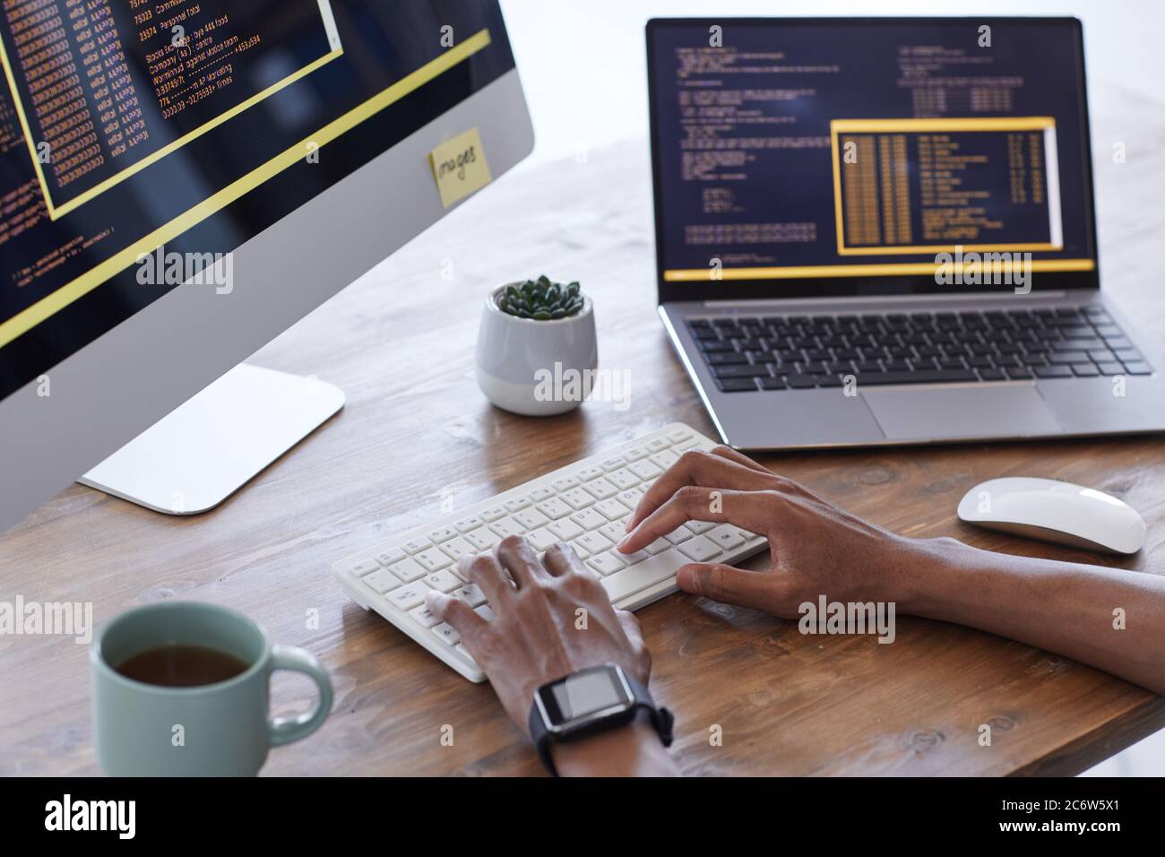 Background image of male hands typing on keyboard while working on ...