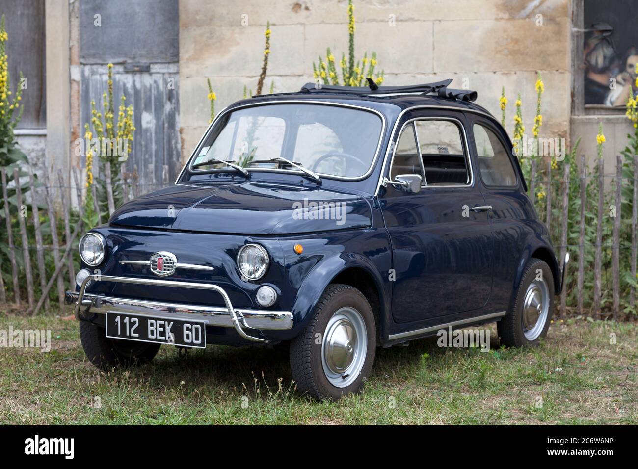 Lamorlaye, France - July 05 2020: The Fiat 500 is a small city car that was manufactured and marketed by Fiat Automobiles from 1957 to 1975. Stock Photo