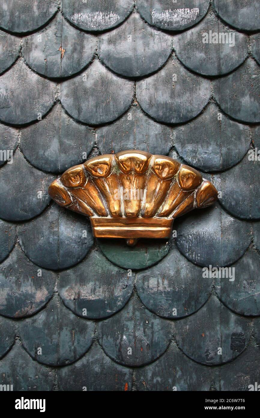 Decorative element. Vintage brass door handle in the form of