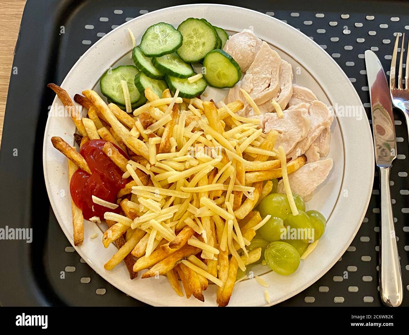 Chicken chips and salad dinner on plate and tray Stock Photo