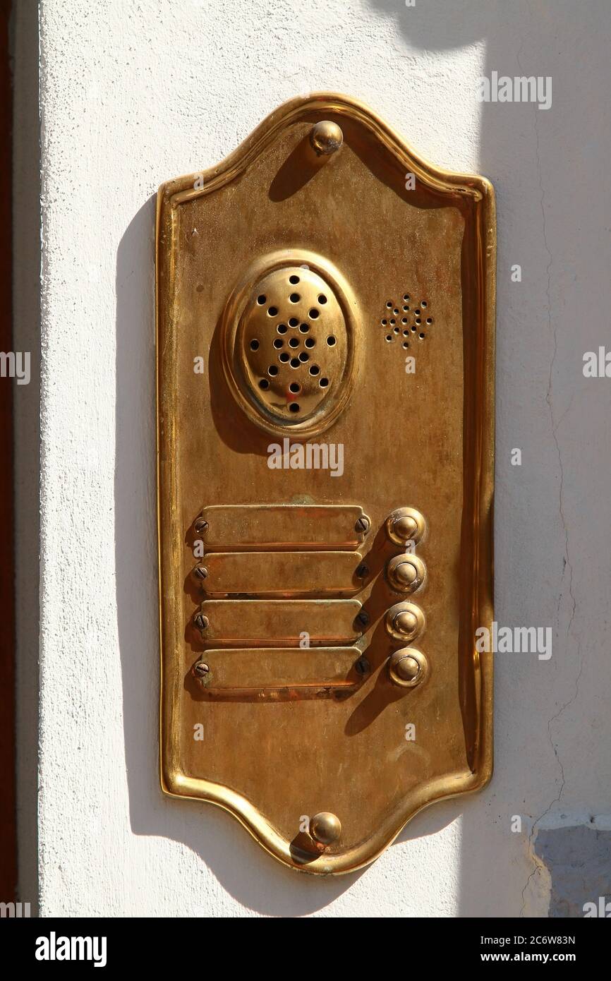 Decorative element. Brass doorbell with nameplates, buttons and