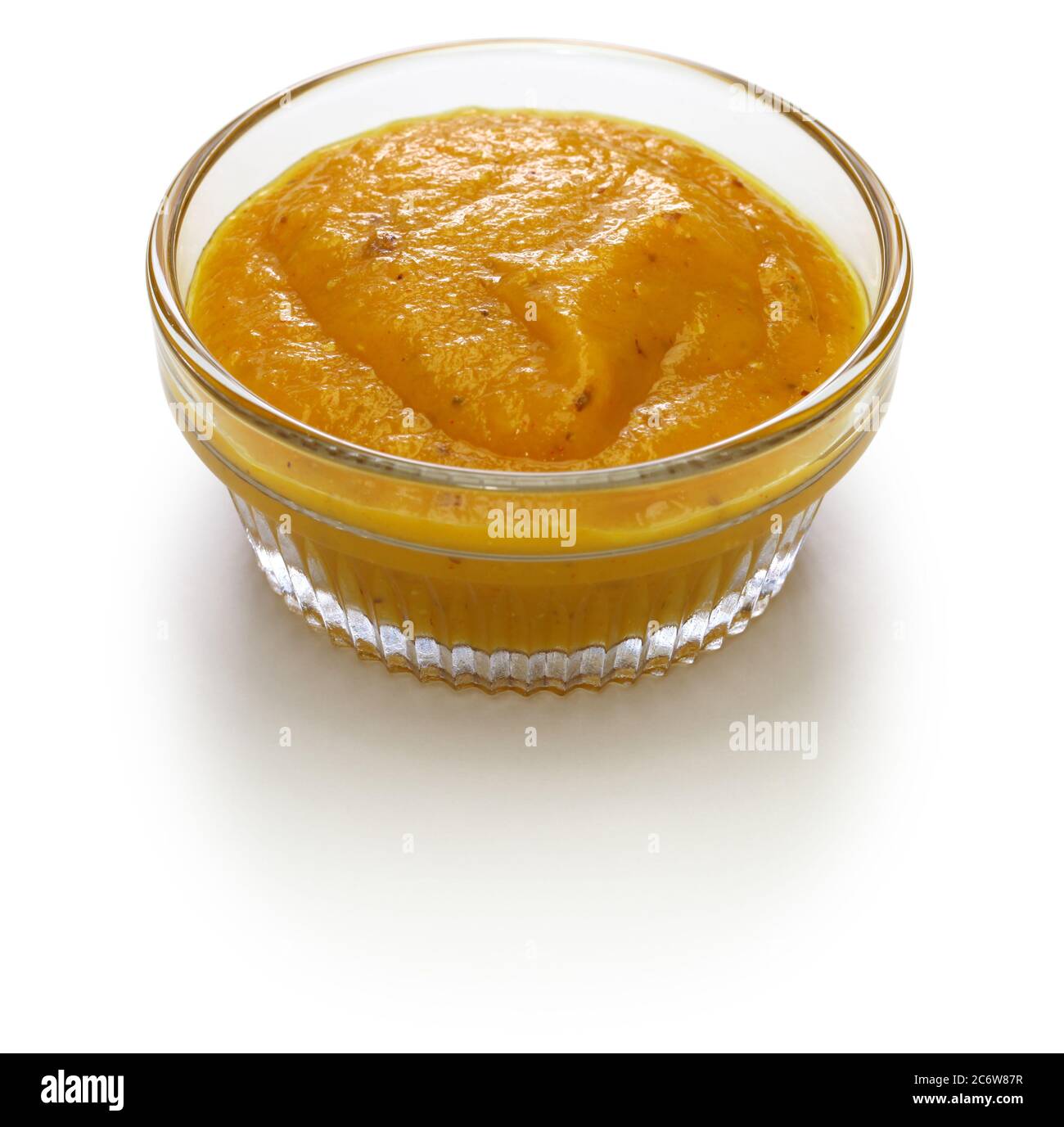 homemade mango amba sauce, israeli condiment isolated on white