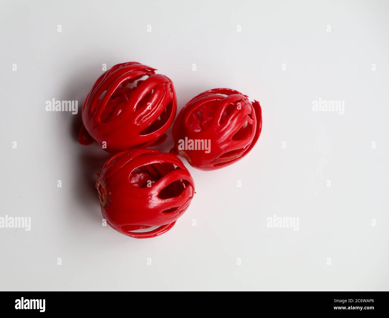Fresh red color nutmeg mace, the seed covering kept against white