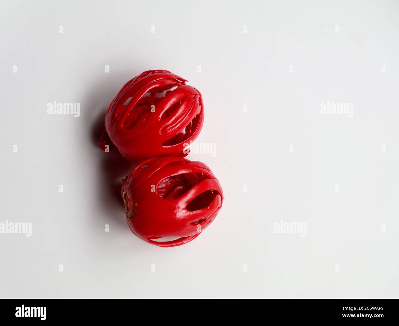 Fresh red color nutmeg mace, the seed covering kept against white
