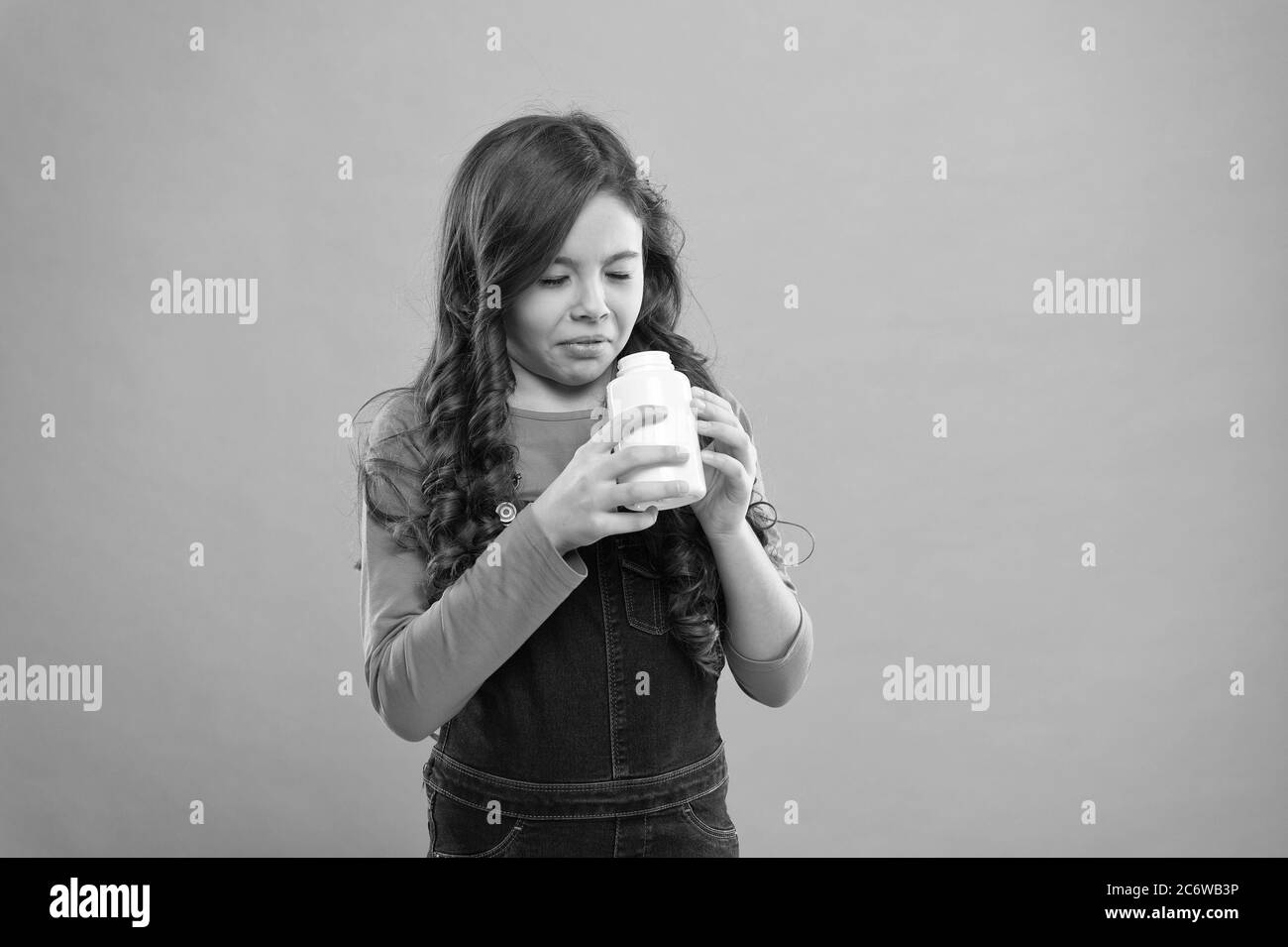 children health care. Take vitamin supplements. little girl do not want