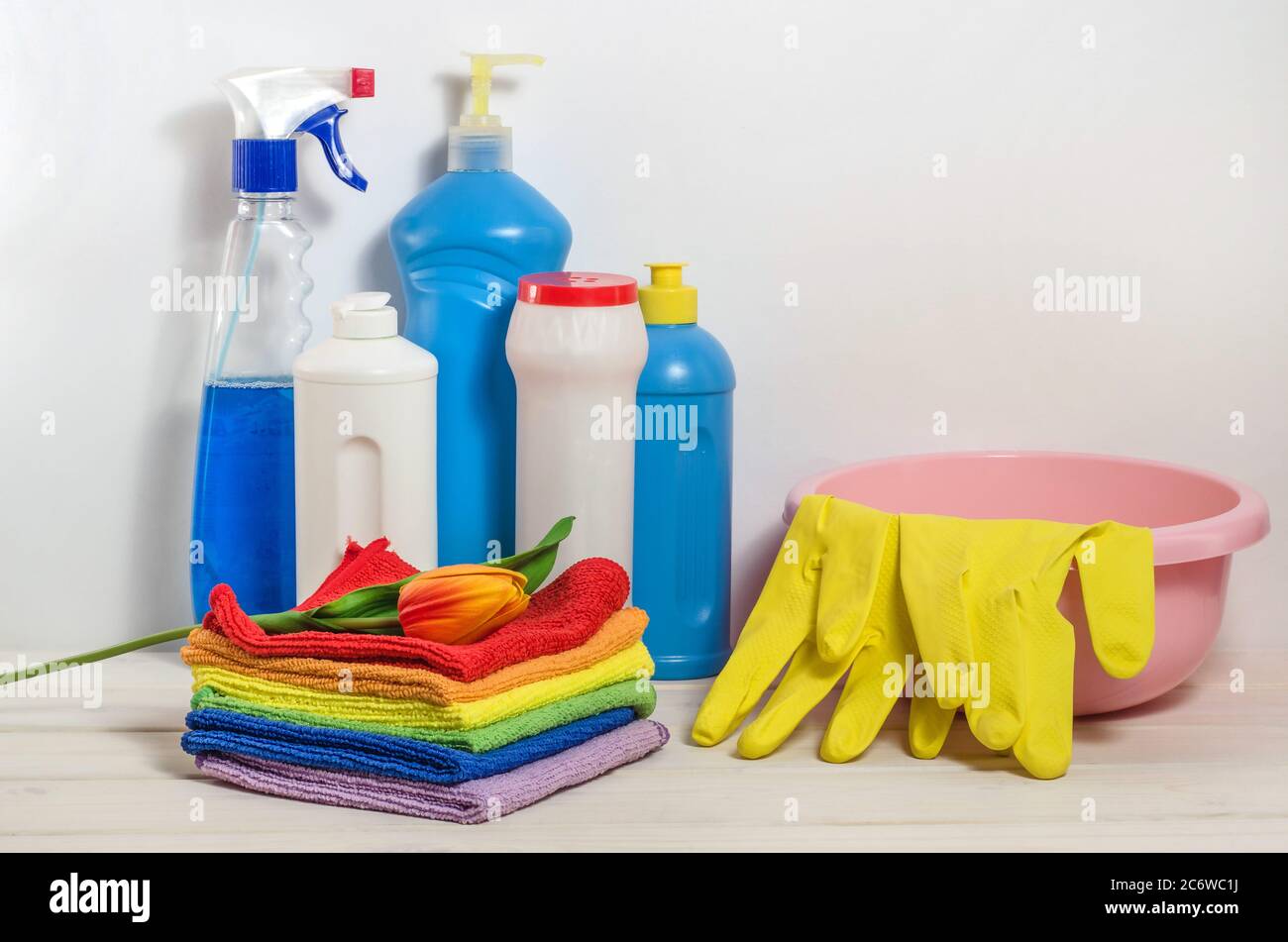 Home cleaning products with colorful napkins on a white background. Spring cleaning, the prevention of viral diseases. Cleaning in the house Stock Photo