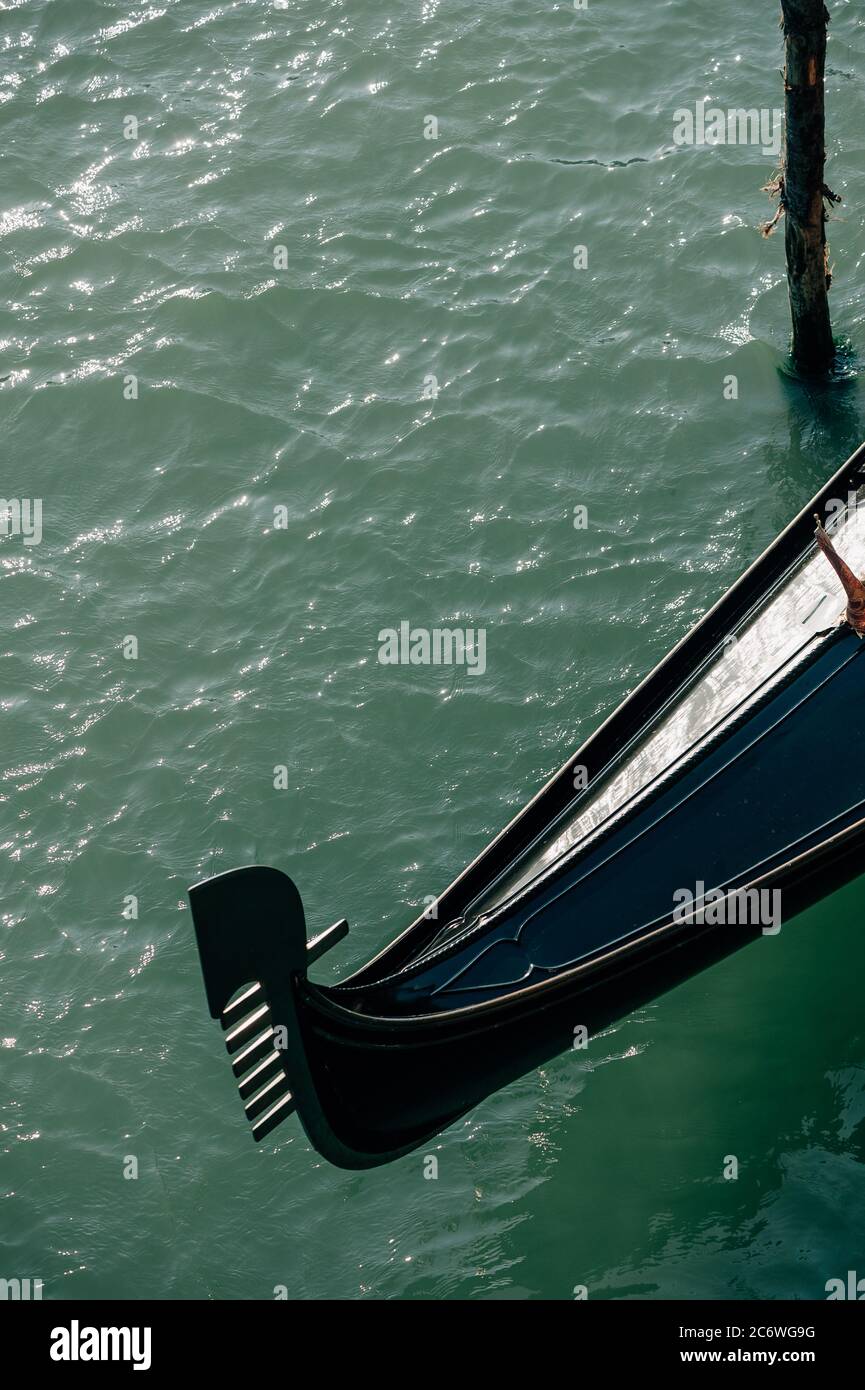 Detail of a Venetian gondola's fero da prorà (prowled; dolphin) which symbolises the city, Venice, Veneto, Italy Stock Photo
