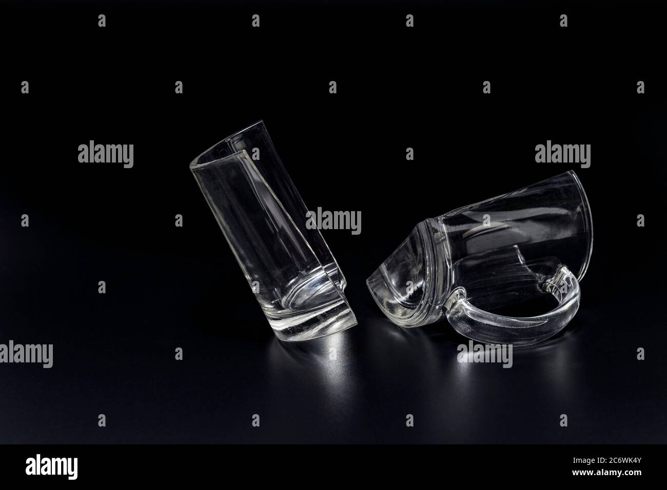 Broken glass cup on black background, incident concept Stock Photo Alamy