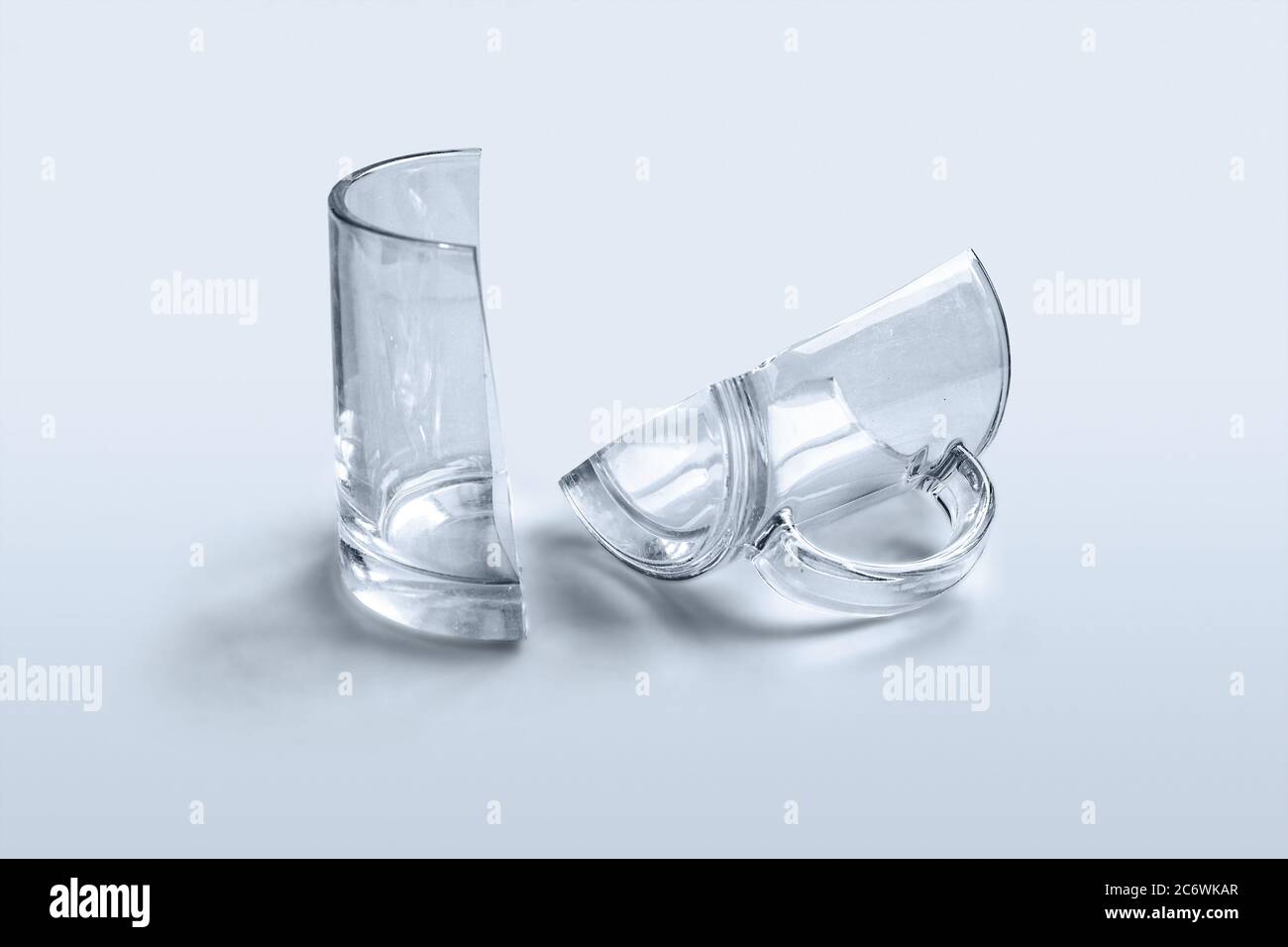 https://c8.alamy.com/comp/2C6WKAR/broken-glass-cup-two-halves-2C6WKAR.jpg