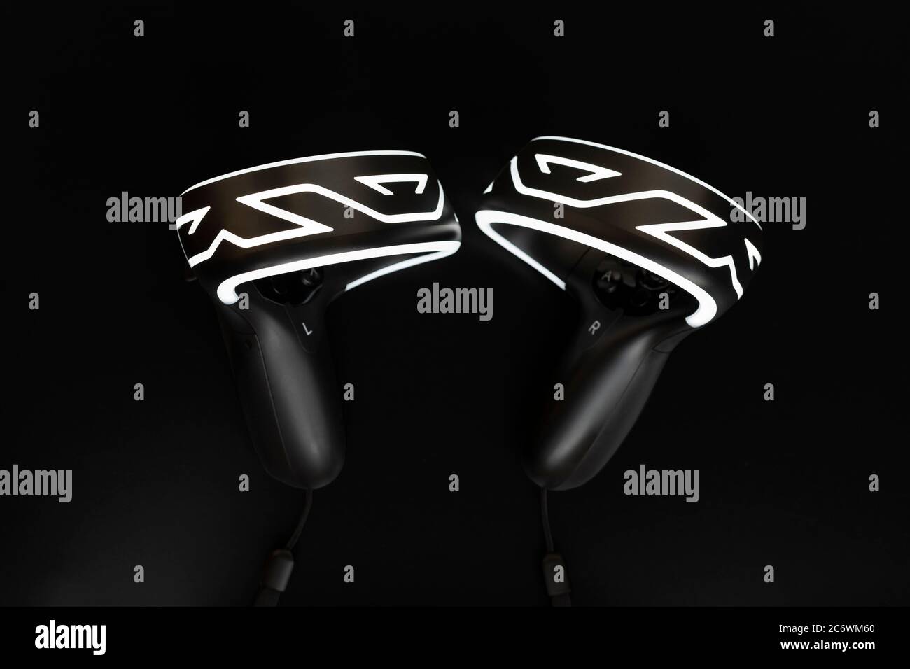 Modern virtual reality controllers on black background Stock Photo