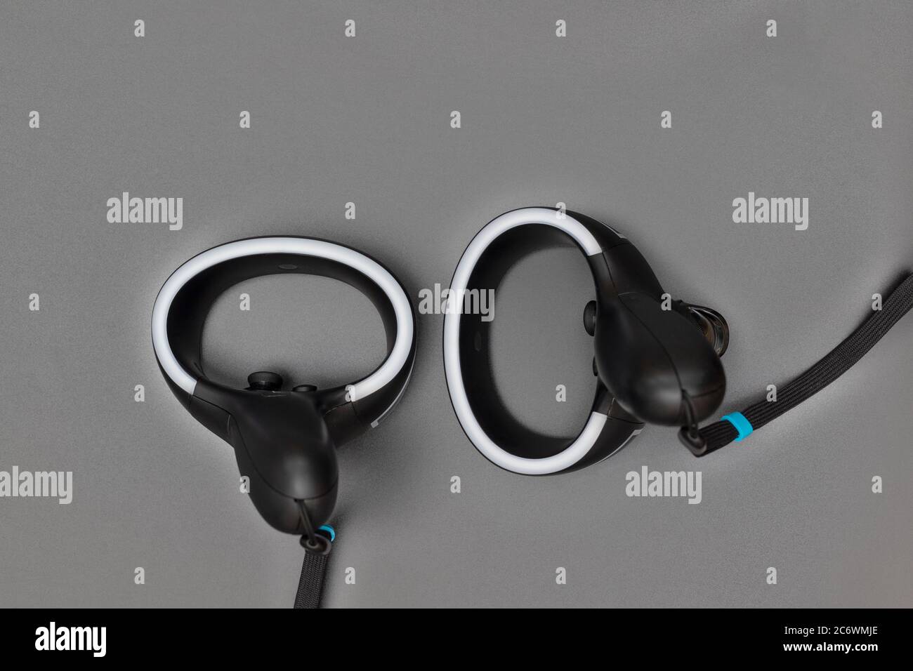 Virtual reality controllers with a led light on gray background Stock Photo